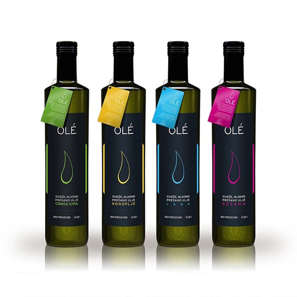 OLÉ organic oil bottles with vivid color-coded labels