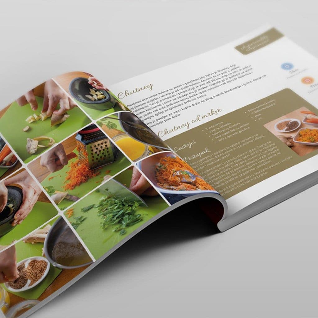 Open ayurvedic cookbook spread with recipe photography grid
